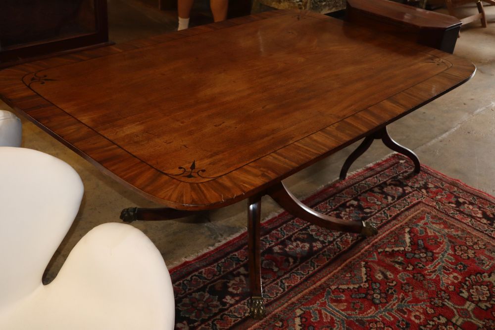 A Regency ebony inlaid mahogany tilt top dining table, W.156cm, D.100cm, H.72cm
